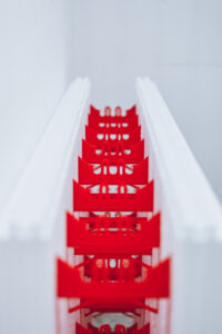 SuperForm ICF block view of red ties down the center length of the block.
